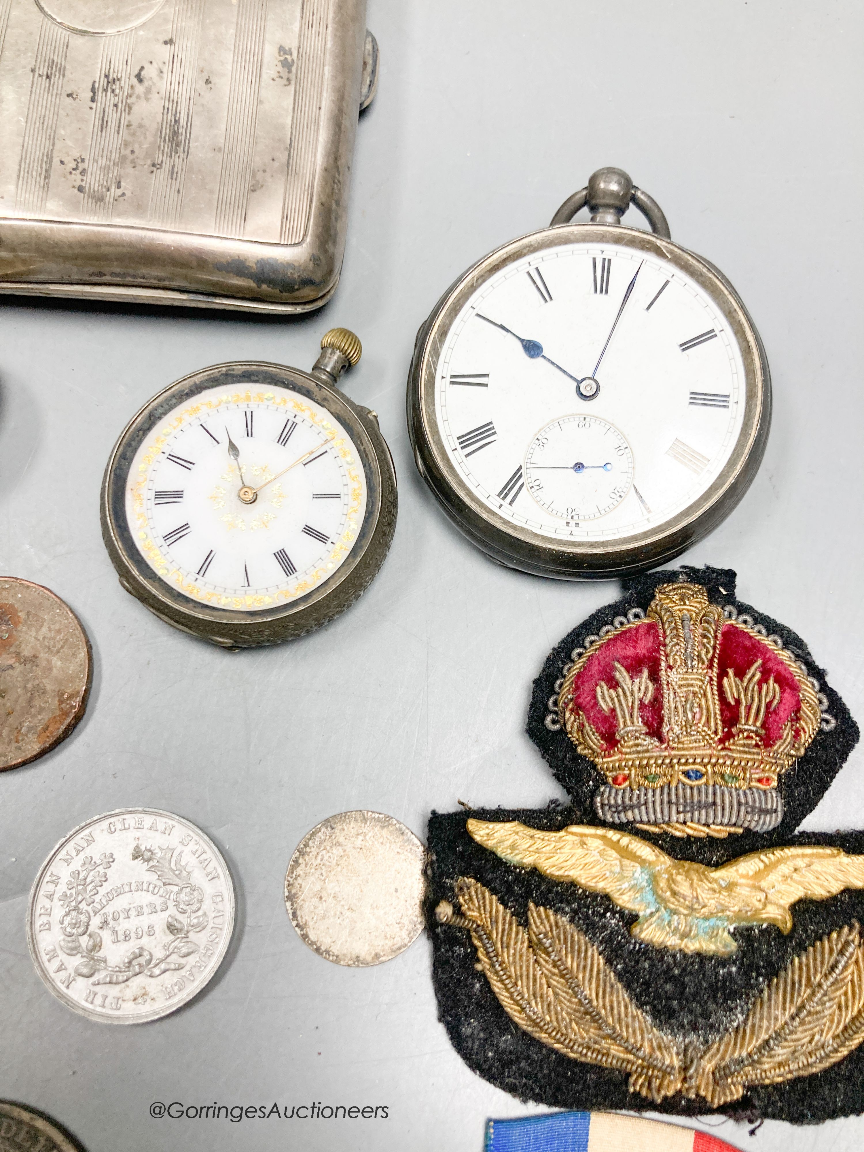 A silver cigarette case, two pocket watches, small pot etc.
